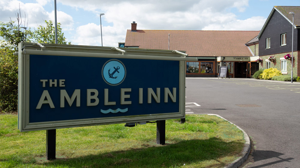 Exterior sign for The Amble Inn, Morpeth